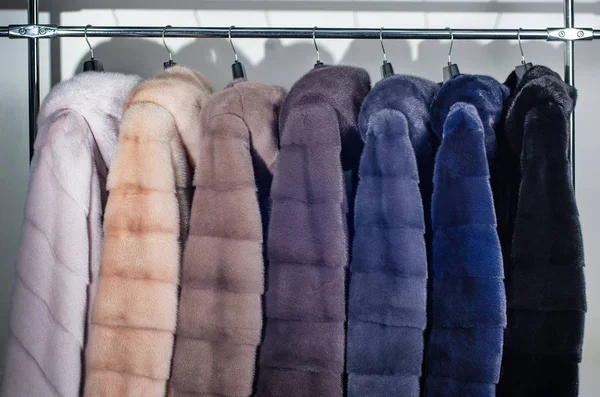 A number of dyed mink fur coats for catalog, different colors close-up — Stock Photo, Image