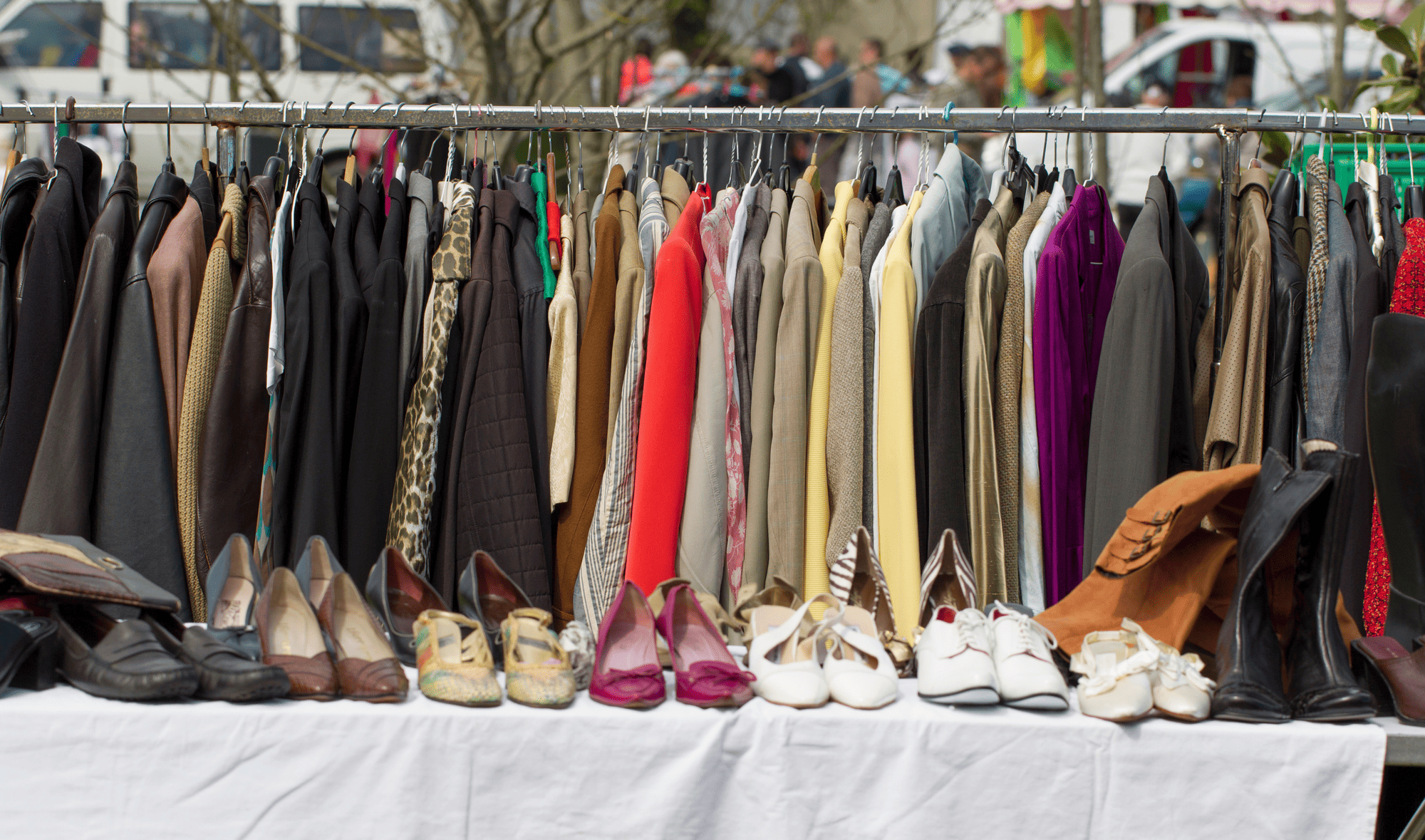 Selling clothes at a garage sale.