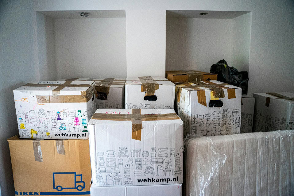 The Ultimate Guide to Stress-Free Relocation 2 brown cardboard boxes on brown wooden table