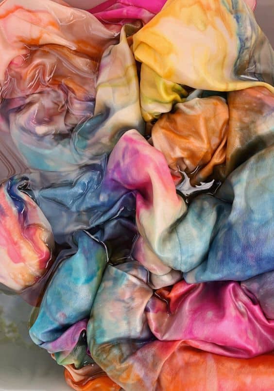 A pile of tie dye clothes.